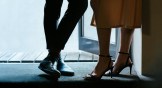 A man's shoes and a woman's high heels
