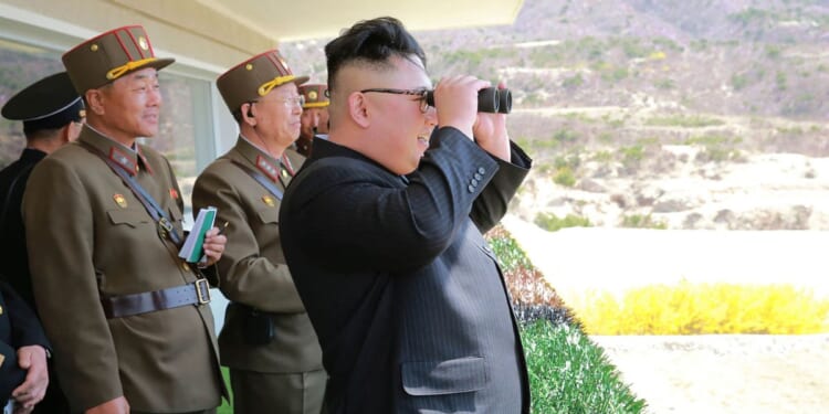 Kim Jong-Un, right, inspects the "Dropping and Target-striking Contest of KPA Special Operation Forces - 2017" in North Korea.