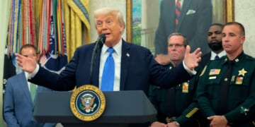 President Donald Trump speaks alongside members of the Palm Beach County Sheriff's Office as he posthumously awards Medals of Sacrifice to fallen officers during a ceremony in the Oval Office of the White House on May 19, 2025, in Washington, D.C.