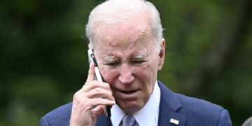 President Joe Biden speaks on the phone during a National Small Business Week event in the Rose Garden of the White House in Washington, D.C., on May 1, 2023.