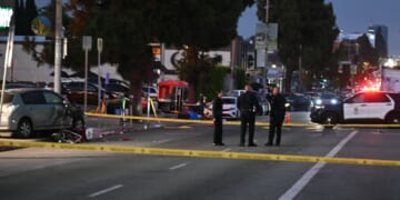 Officers patrol the scene where a crashed vehicle drove into a large crowd in Los Angeles on July 19, 2025.