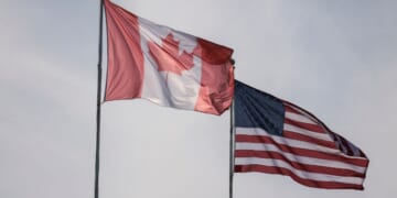 The flags of Canada, left, and the United States, right, are pictured at Peace Arch Historical State Park in Blaine, Washington, on March 5.
