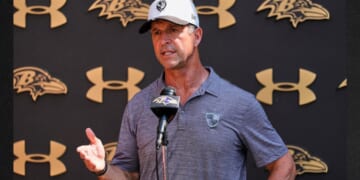 Baltimore Ravens head coach John Harbaugh speaks to media after practice Wednesday at the team's NFL football training camp in Owings Mills, Maryland.