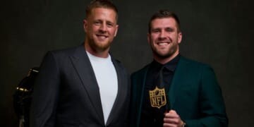 J.J. Watt, left, and T.J. Watt, right, pose for a photo after T.J. won the Deacon Jones Sack Leader Award during the NFL Honors show in Inglewood, California, on Feb, 10, 2022.