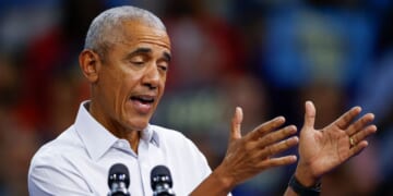 Former President Barack Obama gestures as he speaks at a campaign rally with Minnesota Governor Tim Walz at the Alliant Center in Madison, Wisconsin, on Oct. 22, 2024.