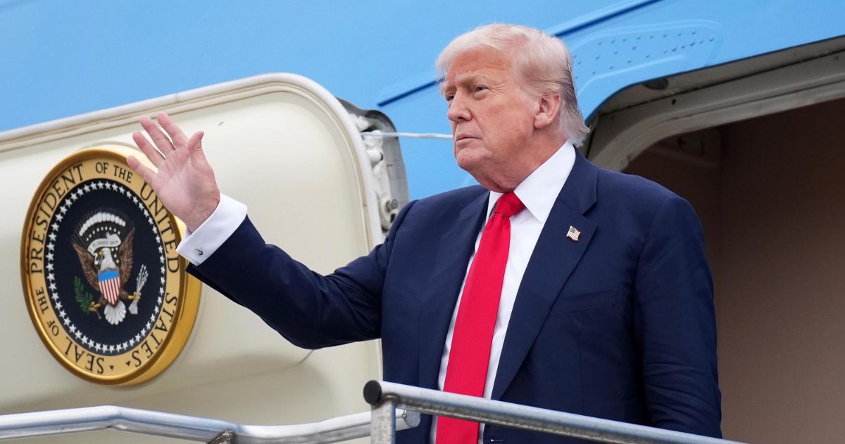 President Donald Trump waves as he arrives at Glasgow Prestwick Airport on July 25, 2025, in Prestwick, Scotland.