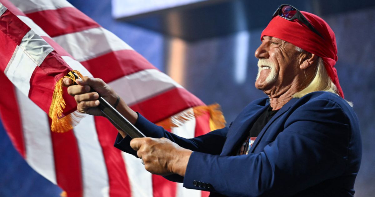 Hulk Hogan waves the U.S. flag as he speaks during the last day of the 2024 Republican National Convention in Milwaukee, Wisconsin, on July 18.