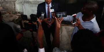 Haitian police arrest a former senator accused of working with gangs to attack a peaceful community