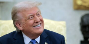 U.S. President Donald Trump beams while he speaks with reporters in the Oval Office of the White House in Washington, DC, on April 24, 2025.
