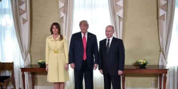 President Donald Trump, Russian President Vladimir Putin, and First Lady Melania Trump pose ahead of a meeting in Helsinki, Finland, on July 16, 2018.