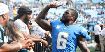 Denzel Perryman #6 of the Los Angeles Chargers throws his glove to fans after a game against the Carolina Panthers in a file photo from Sept.15.