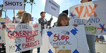 People demonstrate against COVID vaccine mandates for students in Huntington Beach, California on Jan. 3, 2022.