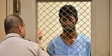 Rapper Lil Nas X, right, looks on at the conclusion of his arraignment at Los Angeles Superior Court in Van Nuys, California, on Monday.