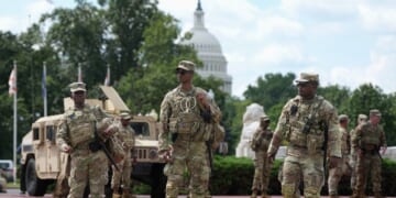 Members of the National Guard stand outside Union Station on Aug. 14, 2025, in Washington, D.C.