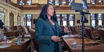 Texas Democrat State Rep. Nicole Collier films herself speaking from the House floor.