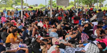 Migrants, mostly from Central America and Venezuela, rest on their way to the United States in Huixtla, Mexico, on July 24.