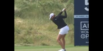Golfer Mimi Rhodes prepares to swing before knocking in a hole-in-one at the Women's British Open on Aug. 3.