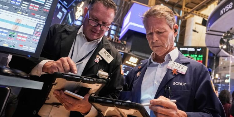 Wall Street holding near its record heights