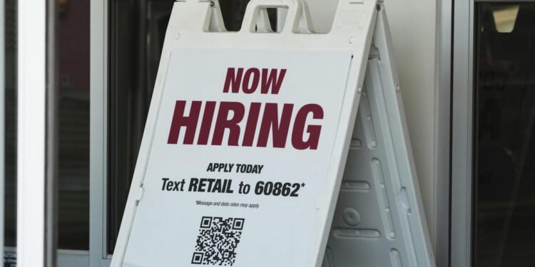 Fewer Americans file for jobless benefits despite signs of a slowing labor market