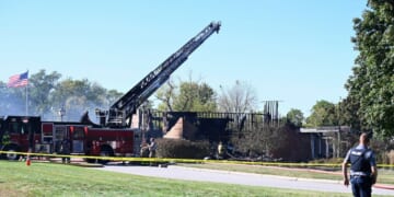 Law enforcement officers guard the area near where the attack took place at a Latter-day Saints church in Grand Blanc, Michigan, on Sept. 28, 2025.