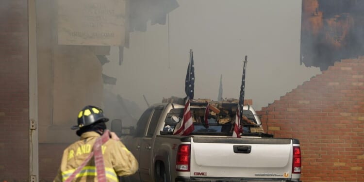 Police remain on scene at burned out Michigan church after shooting and fire