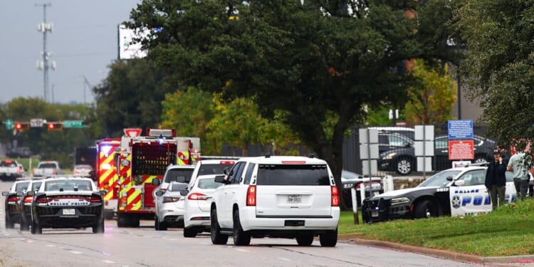 Law enforcement and emergency personnel respond near the scene of a shooting at a U.S. Immigration and Customs Enforcement detention facility in Dallas, Texas, on Sept. 24, 2025.