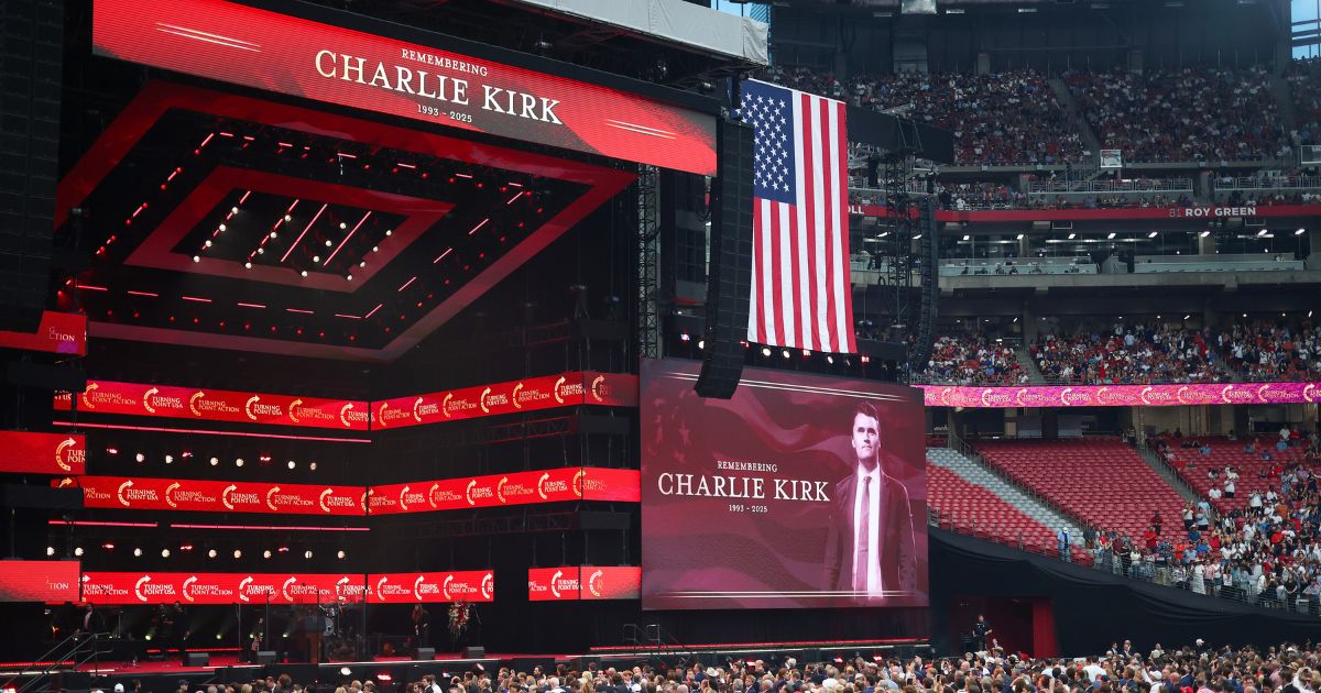 Attendees fill State Farm stadium for the memorial service of Charlie Kirk in Glendale, Arizona, on Sept. 21, 2025.