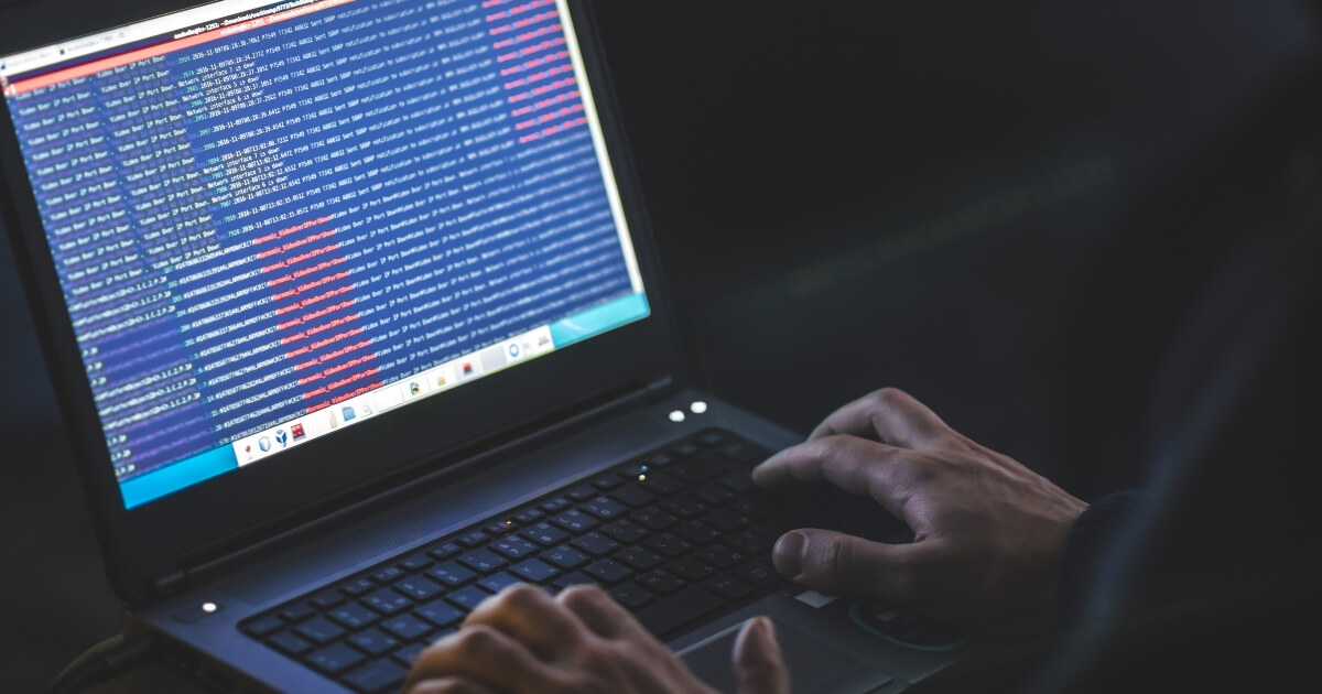 This stock image shows a man downloading computer files.