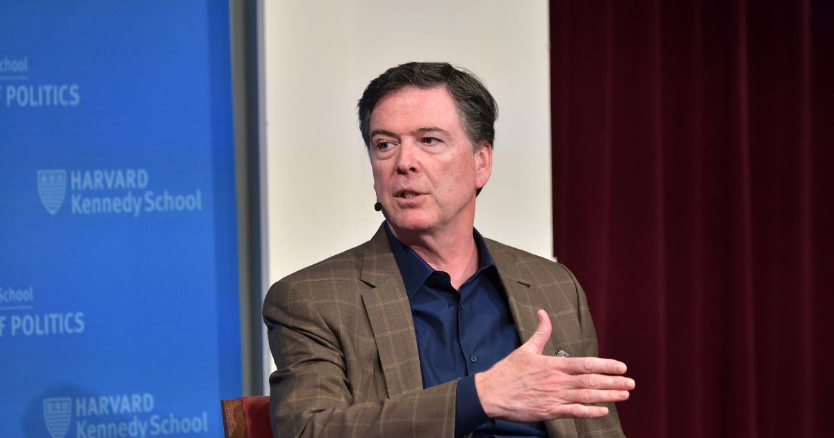 Former FBI Director James Comey speaks at Harvard Kennedy School with Harvard's Eric Rosenbach on Feb. 24, 2020, in Boston, Massachusetts.