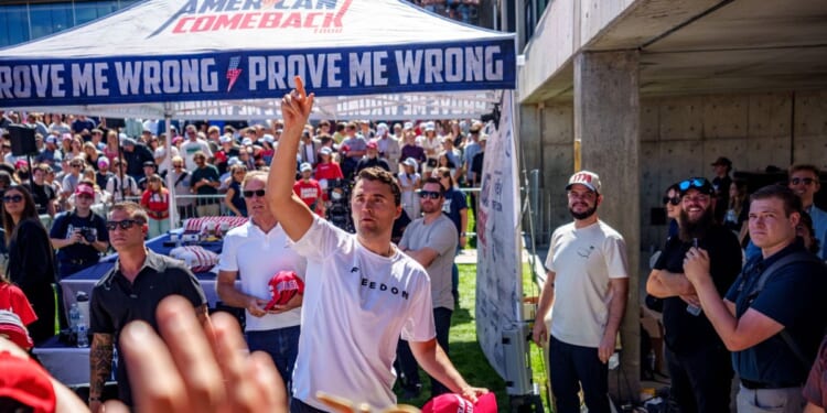 Charlie Kirk throws hats to the crowd after arriving at Utah Valley University on Sept. 10, 2025, in Orem, Utah.