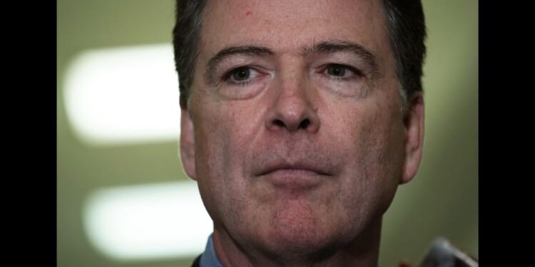 Former FBI Director James Comey speaks to the media on Capitol Hill in Washington, DC on Dec. 7, 2018.