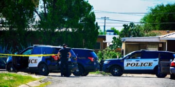 Multiple police officers at a crime scene in Tucson, Arizona.