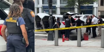 Fire investigators examine the Secret Service vehicle that caught fire Monday in Washington, D.C.