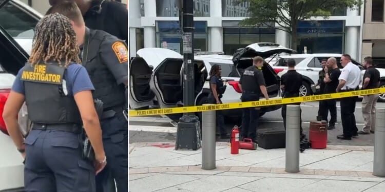 Fire investigators examine the Secret Service vehicle that caught fire Monday in Washington, D.C.