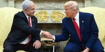 Israeli Prime Minister Benjamin Netanyahu, left, and President Donald Trump, right, shake hands during a meeting in the Oval Office of the White House in Washington, D.C., on April 7.