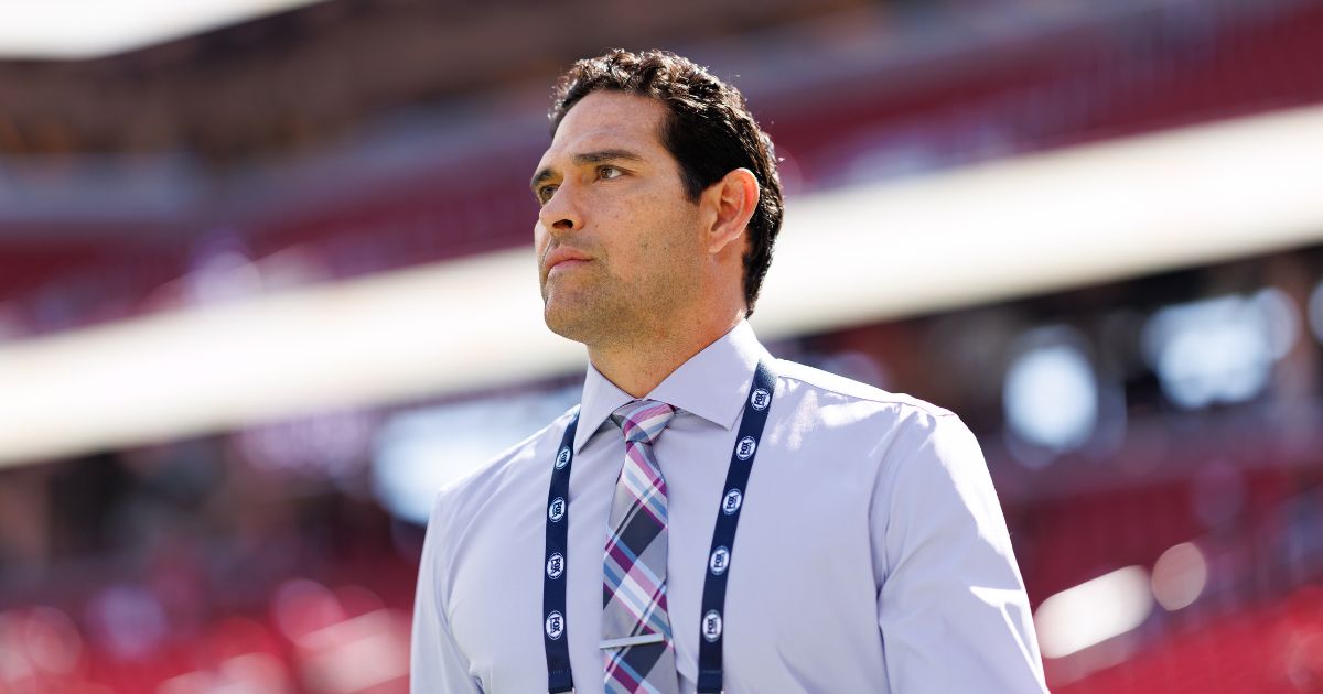 NFL broadcaster Mark Sanchez stands on the field prior to a game between the Arizona Cardinals and the San Francisco 49ers at Levi's Stadium on Sept. 21, 2025, in Santa Clara, California.