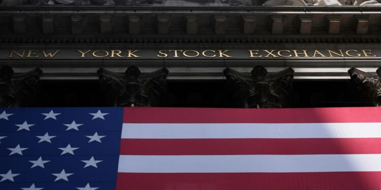 Wall Street hovers near all-time highs with solid performances from top companies