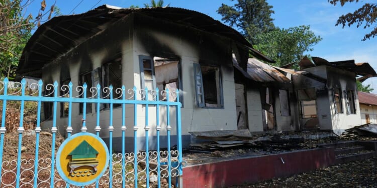 As both sides in civil war vie for control, a Myanmar town lies in shambles