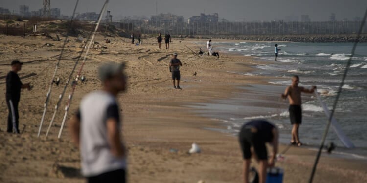 Hamas reaffirms commitment to ceasefire as delays in returning hostages' bodies fray nerves