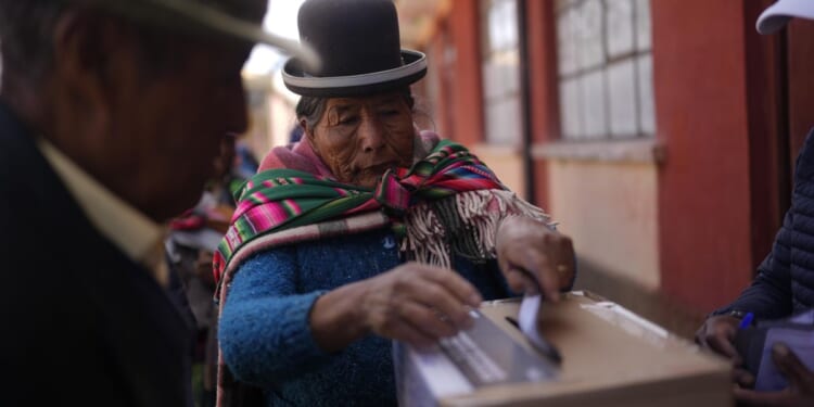 Voters in Bolivia head to polls in a tight runoff as they seek a president to lift them from crisis
