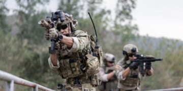 Soldiers in camouflage military uniform on a mission.