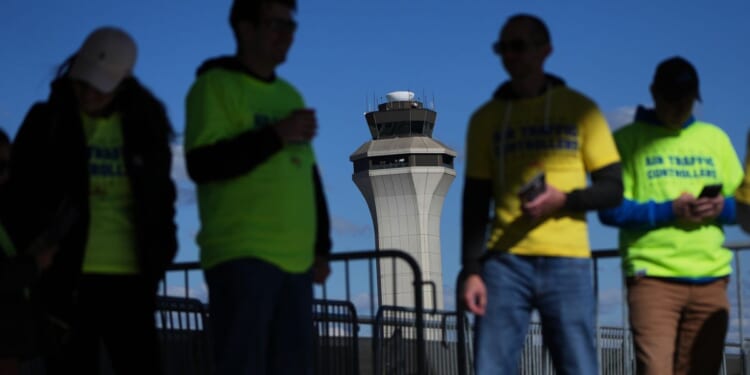 Isolated flight delays may spread as air traffic controllers go without pay during shutdown