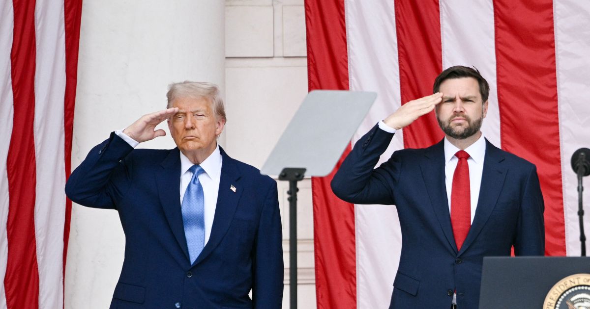 President Donald Trump and Vice President J.D. Vance salute at the National Memorial Day Observance at the Memorial Amphitheatre in Arlington National Cemetery in Arlington, Virginia, on May 26, 2025.