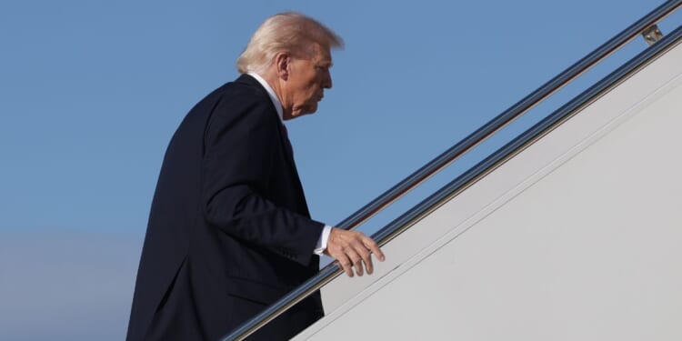 President Donald Trump climbs the stairs to Air Force One in Maryland on Oct. 17, 2025.