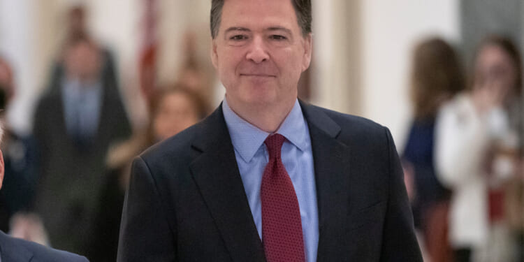 Former FBI Director James Comey arrives to testify under subpoena behind closed doors before the House Judiciary and Oversight Committee on Capitol Hill in Washington, D.C., on Dec. 7, 2018.