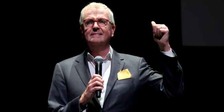 New Jersey Governor Phil Murphy, seen in a 2024 photo, was again reported to be out of the country as the State of Emergency was declared.