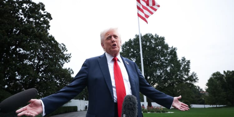 President Donald Trump speaks to the media as he departs the White House in Washington, D.C., on Tuesday.