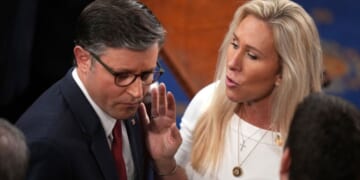 House Speaker Mike Johnson of Louisiana, seen with fellow Republican Rep. Marjorie Taylor Greene of Georgia in a January photo, clashed over the government shutdown during a conference call Tuesday.