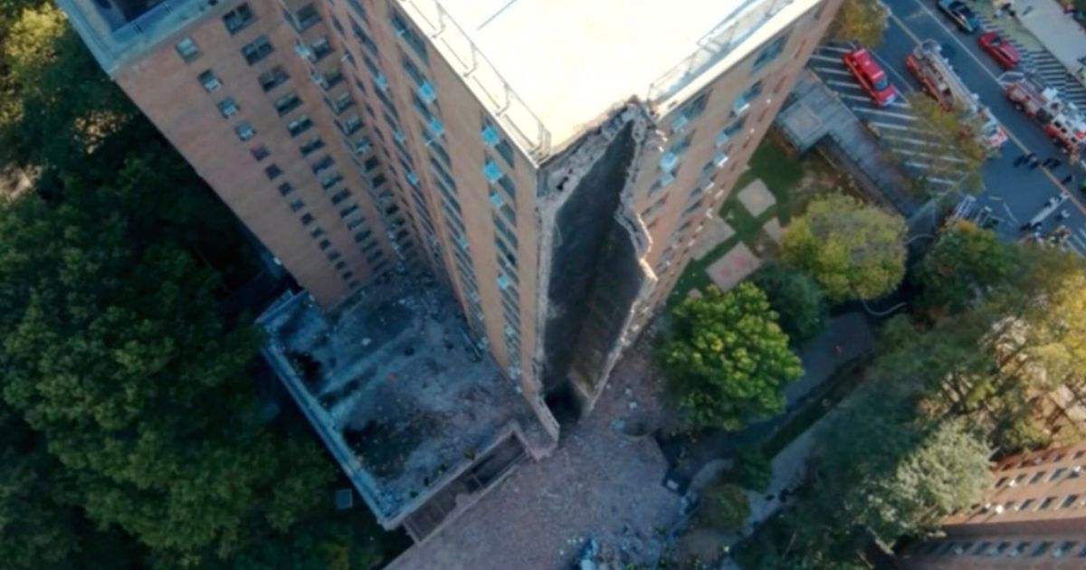 A high-rise apartment building partially collapsed after a suspected gas explosion in New York City on Wednesday.