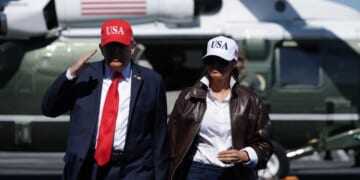 President Donald Trump and first lady Melania Trump arrive on the deck of the USS George H.W. Bush aircraft carrier in Naval Station Norfolk, Virginia, on Sunday.